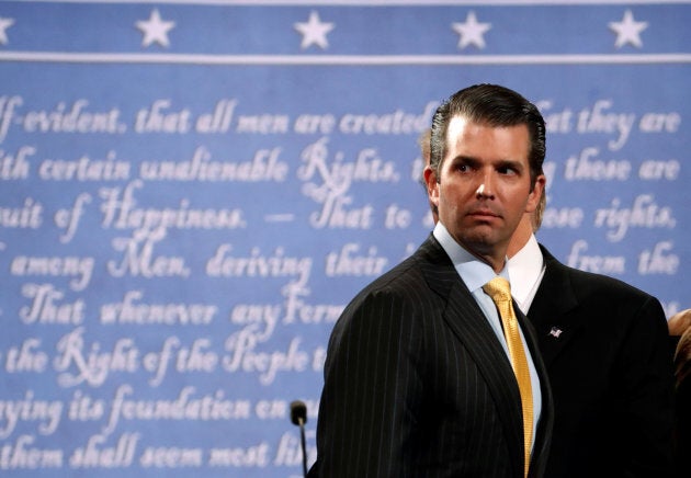 Donald Trump Jr. stands onstage with his father Republican U.S. presidential nominee Donald Trump after Trump's debate against Democratic nominee Hillary Clinton at Hofstra University in Hempstead, New York, Sept. 26, 2016.