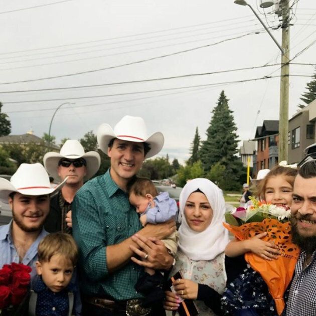 Prime Minister Justin Trudeau poses with baby Justin-Trudeau Adam Bilal and his family in Calgary on Saturday.