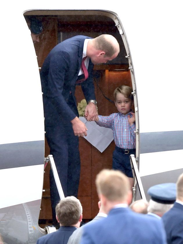 Prince William and Prince George departing from the plane. (Photo by Karwai Tang/WireImage)