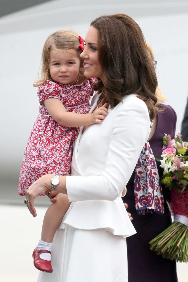 The Duchess of Cambridge carrying Princess Charlotte.