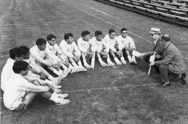 Aboriginal teenagers gather on the field at Winnipeg Stadium in this 1967 photo. Thirty-two years after the group relay-ran the Pan Am torch from St. Paul, Minn., to the gates of Winnipeg Stadium only to have a white athlete take the glory lap, seven of the survivors will finally complete the journey July 23.