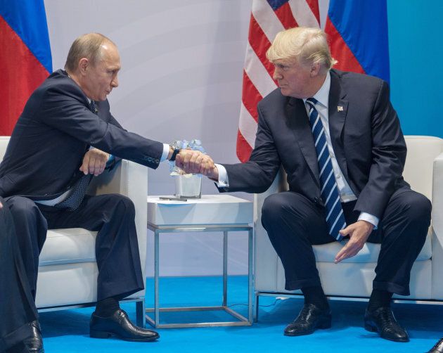 Russian President Vladimir Putin and President Donald Trump shake hands during a meeting at G20 Summit on July 7, 2017 in Hamburg, Germany.
