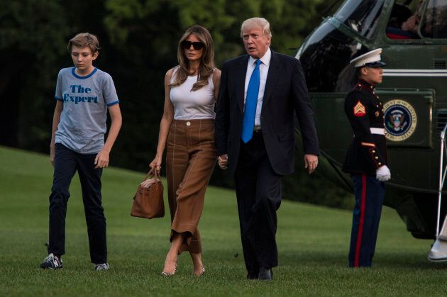 President Donald Trump, first lady Melania, and their son, Barron, walk from Marine One across the South Lawn at the White House in Washington, DC on June 11, 2017.