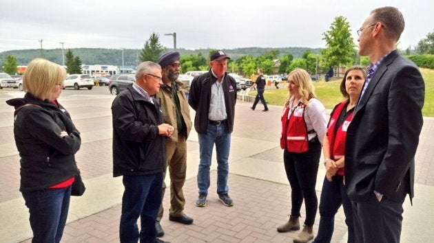 Public Safety Minister Ralph Goodale, second from left, and Defence Minister Harjit Sajjan, to the right of him, met with provincial officials in Kamloops.