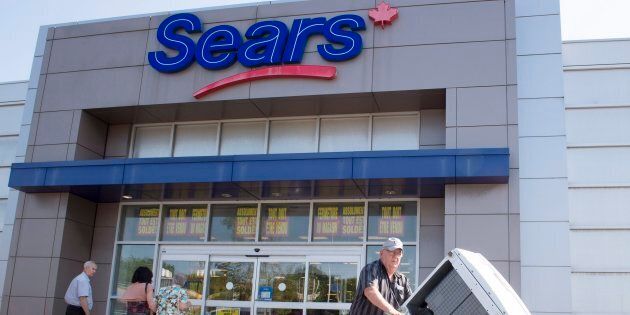 Bargain hunters are seen at the Sears store in St. Eustache, Que. on July 21, 2017, the first day of liquidation sales at 54 Sears locations nationwide.