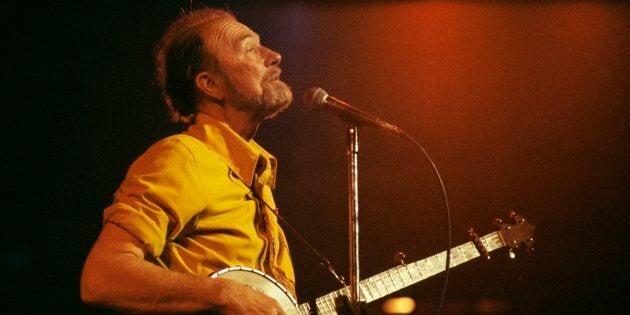 Pete Seeger performing on stage.