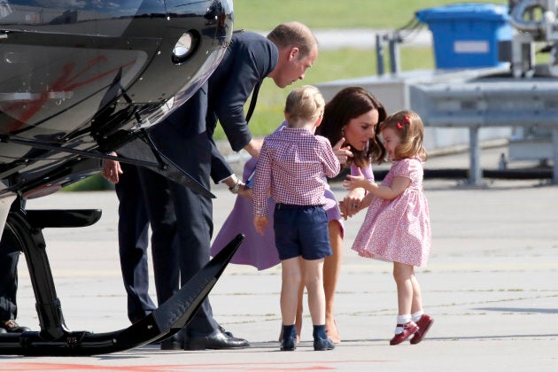 The Duke and Duchess of Cambridge try to calm their daughter who is throwing a tantrum. (Photo by Franziska Krug/Getty Images)