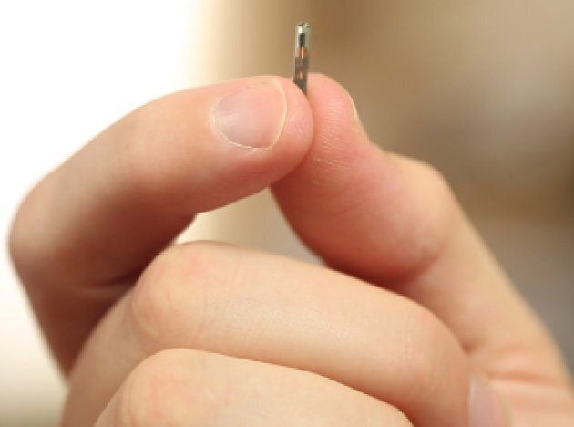 A photo of the microchip implant being embedded in employees by 32M.