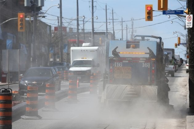 Dust flies as Eglinton businesses west of Yonge Street are being impacted by the crosstown LRT construction in Toronto, Ont. on April 15, 2015.