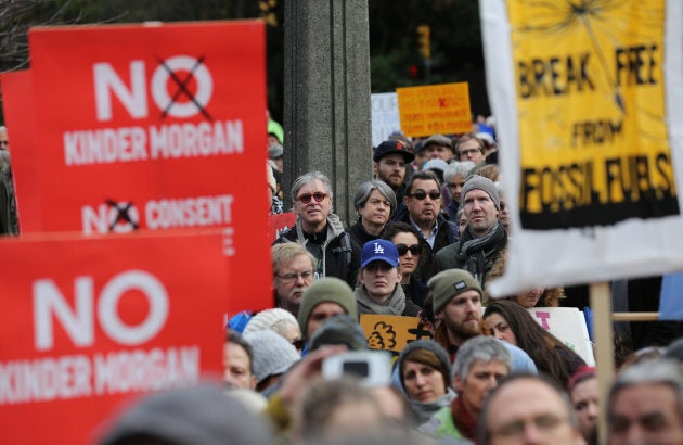 Protesters hold a rally at City Hall before a march against the proposed expansion of Kinder Morgan's Trans Mountain Pipeline in Vancouver on Nov. 19, 2016.