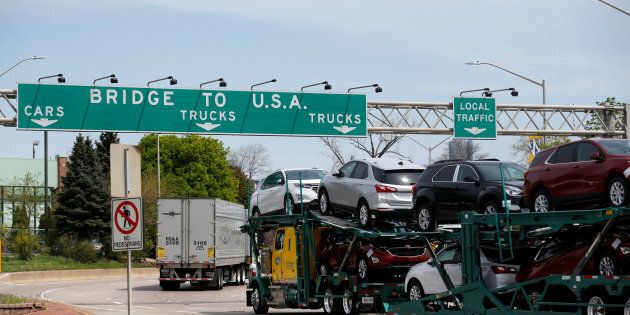 A car hauler heading for Detroit, Michigan, drives on the lane to Ambassador Bridge in Windsor, Ontario, Canada, April 28, 2017.