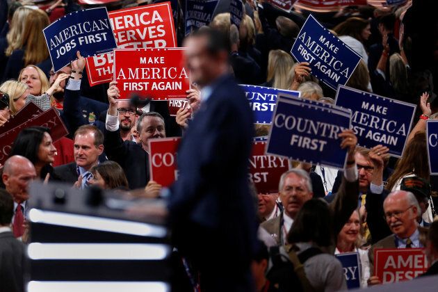 People wave placards during senator Ted Cruz's (R-TX) speech at the Republican National Convention in Cleveland, Ohio, July 20, 2016.