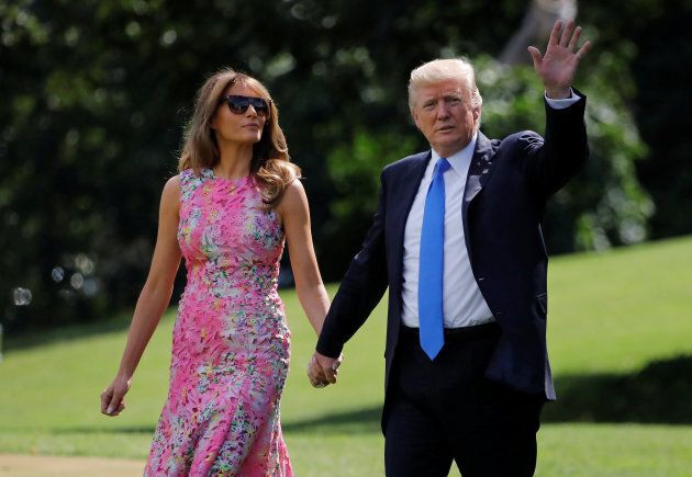 U.S. President Donald Trump waves as he and First Lady Melania Trump depart from the White House on route to Ohio, in Washington, U.S., July 25, 2017.