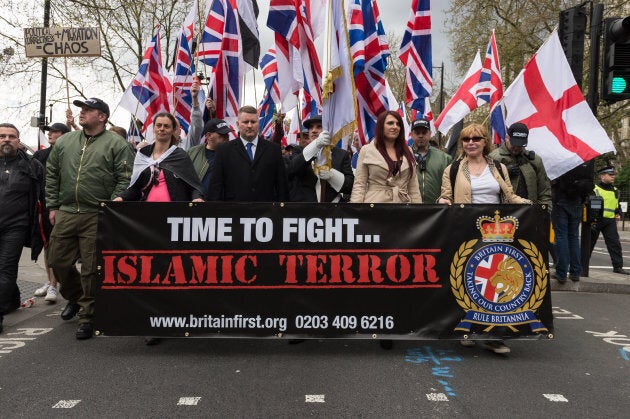 Leaders of Britain First, Jayda Fransen (2R) and Paul Golding (3L) lead March Against Terrorism on April 01, 2017 in London, England. Supporters of far-right political movement Britain First gathered in central London to protest against Islam and Islamic terrorism in the wake of the recent Westminster terror attack.