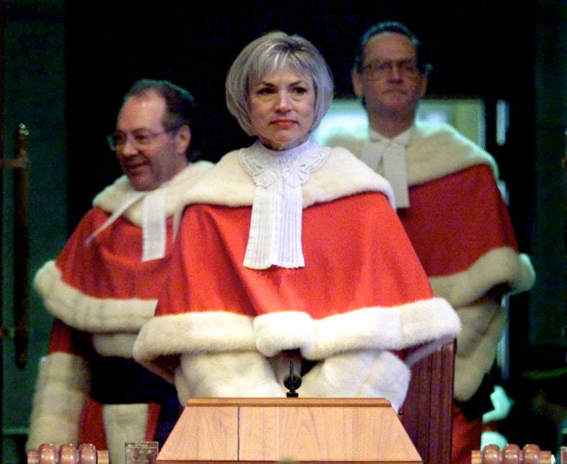 Chief Justice Beverley McLachlin is flanked by Justices Michel Bastarache (L) and Ian Binnie (R) upon their arrival for her swearing-in ceremony at the Supreme Court in Ottawa.