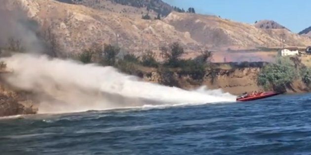 Koyne Watson and Tasha Hunt used their jet boat to try and put out a grass fire east of Kamloops, B.C.