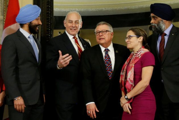 Gen. John Kelly poses with Canada's Innovation, Science and Economic Development Minister Navdeep Bains, Public Safety Minister Ralph Goodale, Foreign Minister Chrystia Freeland and Defence Minister Harjit Sajjan on Parliament Hill in Ottawa on March 10, 2017.