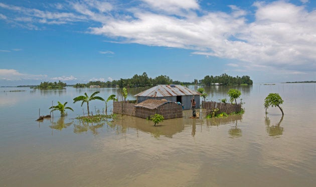 A sinking house is seen during a flood in Lalmonirhat, Bangladesh on July 15, 2017. Bangladesh is one of the most climate change-vulnerable and disaster-prone countries in the world.