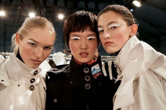 (L-R) Jess PW, model and Amber Witcomb pose backstage prior the Kenzo Menswear Fall/Winter 2017-2018 show. (Photo by Lorenzo Palizzolo/Getty Images)