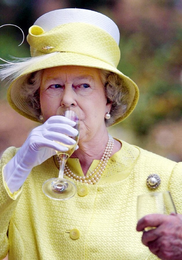 British's Queen Elizabeth II samples a Barrosa wine while visiting Chateau Barrosa in Adelaide, 28 February 2002. The British monarch, who is in Australia on the final leg of her golden jubilee tour, will officially open the Commonwealth Heads of Government Meeting (CHOGM) in Coolum on 02 March. (Photo credit should read RUSSEL MILLARD/AFP/Getty Images)