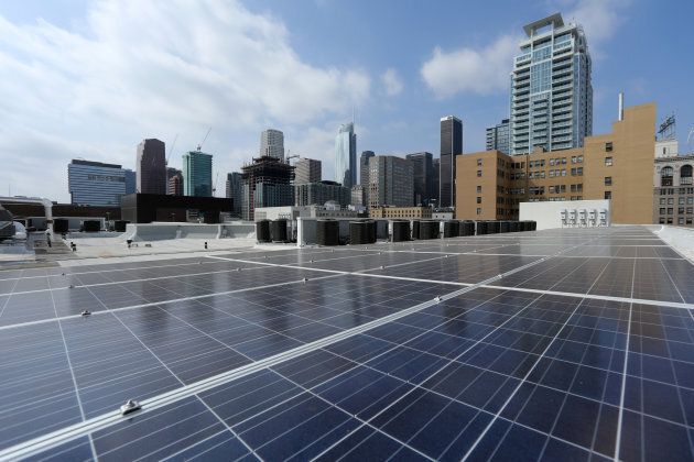 Solar electric panels are shown installed on the roof of the Hanover Olympic building, the first building to offer individual solar-powered net-zero apartments in Los Angeles, Calif., June 6, 2017.
