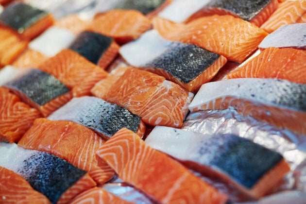 Traditional salmon fillets being sold at a farmer's market.