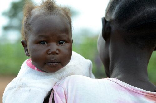 Little Miskimba was the first of her family to be born in Uganda. Her parents and siblings are among the almost a million South Sudanese refugees who have fled to Uganda.