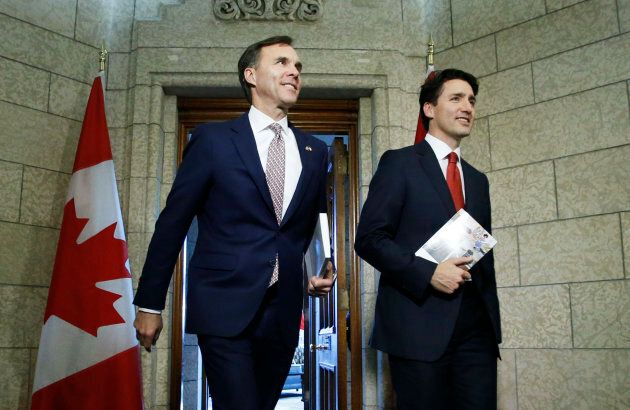 Prime Minister Justin Trudeau and Finance Minister Bill Morneau walk from Trudeau's office to the House of Commons to deliver the budget on Parliament Hill in Ottawa, March 22, 2017.
