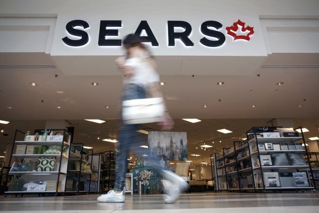A shopper walks past a Sears Canada Inc. store inside a mall in Toronto, Ont. on June 22, 2017. Canadian retailer Sears Canada Inc. is seeking creditor protection as it works to restructure the business. Sears Canada Inc., the struggling offshoot of Sears Holdings Corp., filed for protection from creditors after running short on shoppers and cash.