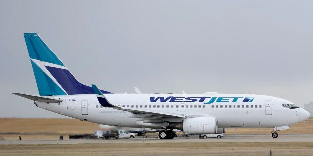 A WestJet plane takes off at the International Airport in Calgary on May 3, 2011.
