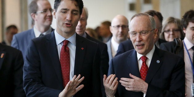 Prime Minster Justin Trudeau (L) arrives with Edmond Mulet, Assistant Secretary-General for Peacekeeping Operations at the United Nations before a news conference in the lobby of the United Nations Headquarters in the Manhattan borough of New York, March 16, 2016.