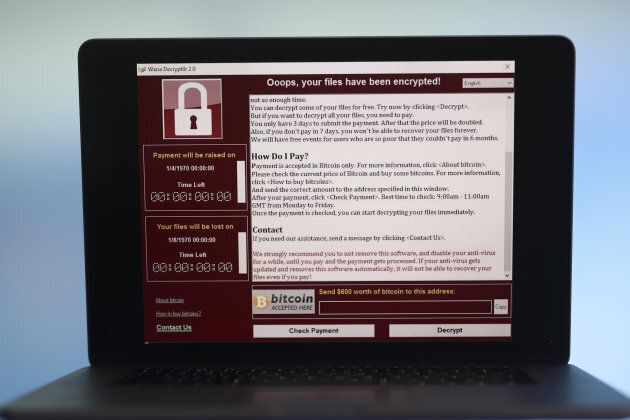 A lock screen from a cyber attack warns that data files have been encrypted on a laptop computer in this arranged photo in London, U.K., on Monday, May 15, 2017.