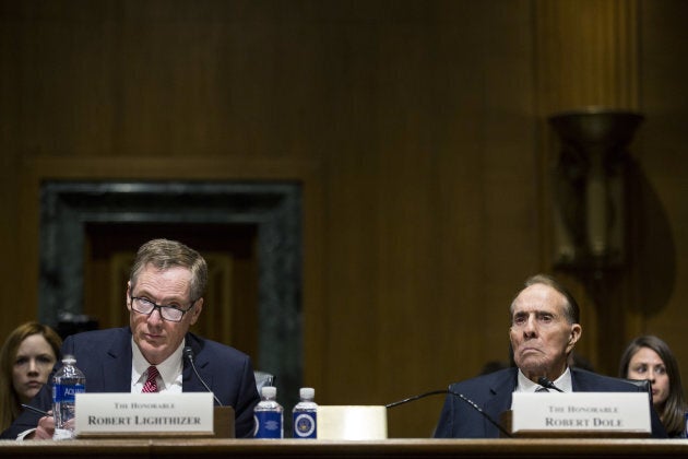 Robert Lighthizer, U.S. trade representative nominee for President Donald Trump, and former Senator Bob Dole, right, listen during a Senate Finance Committee confirmation hearing in Washington, D.C., U.S., on March 14, 2017.