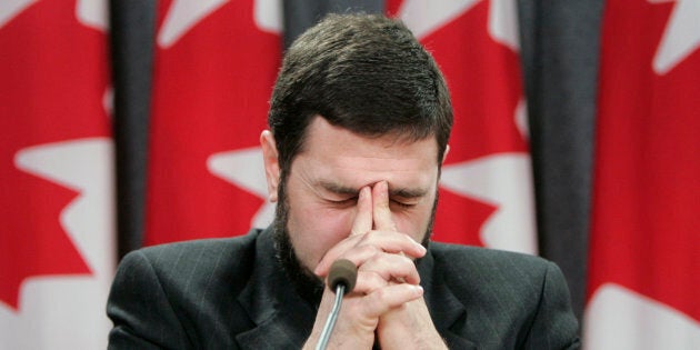 Maher Arar pauses during a news conference in Ottawa, Ont. Jan. 26, 2007.