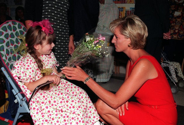 Diana, Princess of Wales, being presented with a bouquet of flowers by a young patient, during her visit to Northwick Park Hospital, in north-west London. She was there to unveil a foundation stone for a new children's casualty centre.