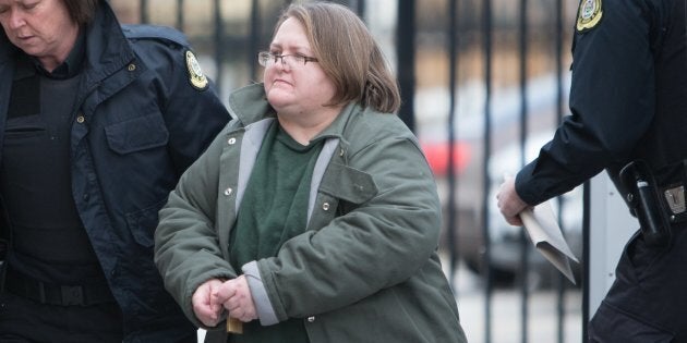 Elizabeth Wettlaufer is escorted into the Woodstock courthouse.