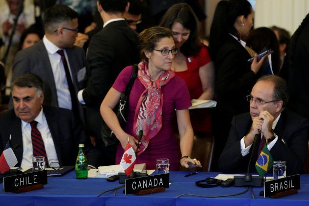 Canadian Foreign Minister Chrystia Freeland (C) takes a seat next to Brazilian Foreign Minister Aloysio Nunes (R) before the Organization of American States (OAS) meeting of foreign ministers to discuss the situation in Venezuela in Washington, U.S., May 31, 2017.
