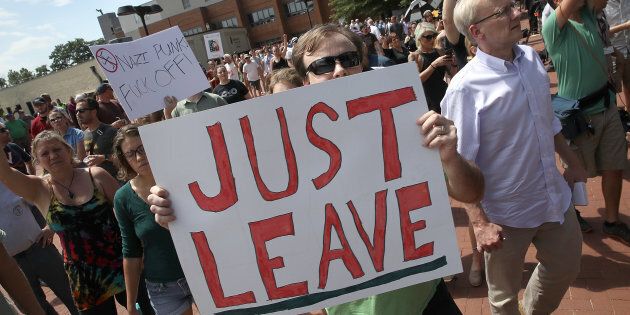 Counter protesters shout outside the Charlottesville City Hall on Aug. 13, 2017 in Charlottesville, Virginia.