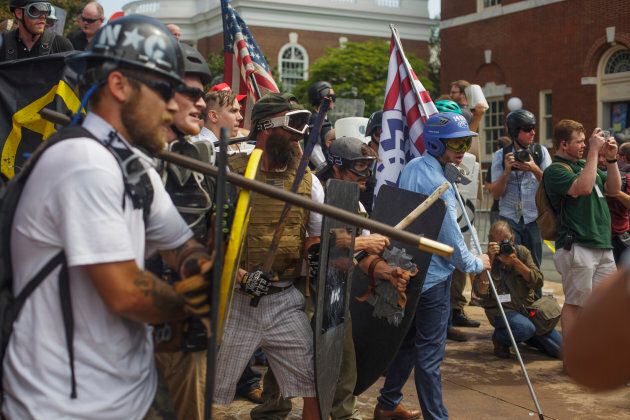 White Supremacists form a phalanx against counter protesters on Aug. 12 2017 in Charlottesville, Virginia, USA.