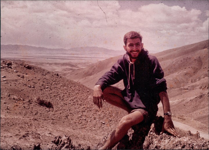 Bus breakdown along the Zahidan to Meshed road. Every bus had two military guards to protect bus from marauders and thieves. As soon as the bus broke down, one soldier and I clamoured up this mountain which I named Mount Diakiw. He took my photo. I placed a small Canadian flag on top.