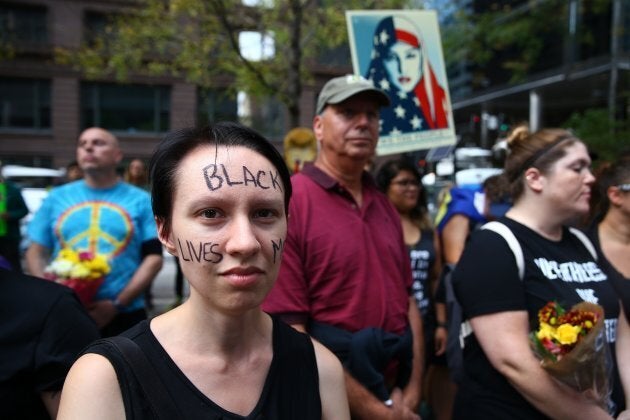 A woman with 'Black Lives Matter' written on her face attends a protest in response to violence erupting at the rally in Charlottesville, at Federal Plaza Square in Chicago, United States on Aug. 13, 2017. People from different ethnicities and groups gathered to defend and demand peace against the hate crimes and racists acts ending up in violent consequences.