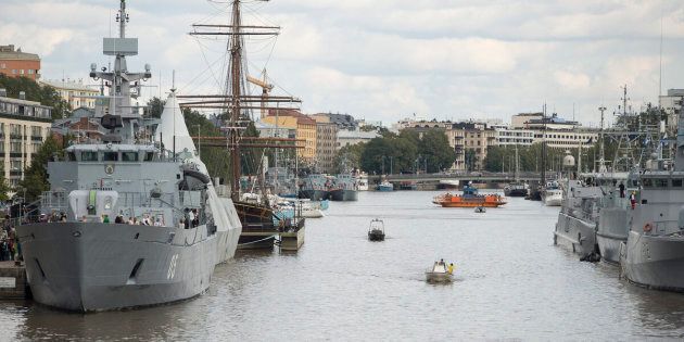 Naval vessels berth along the Aurajoki in Turku on Aug. 31, 2014 during the Northern Coasts 2014 international naval exercise.