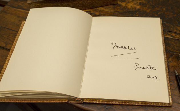 Prince Charles, President of The National Trust signature in the visitors book during a visit to Chartwell House in June 2017 in Westerham, England. (Photo by David Parker - WPA Pool/Getty Images)