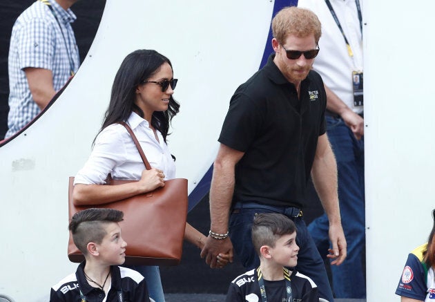 Prince Harry arrives with Meghan Markle at the Invictus Games in Toronto on Sept. 25, 2017.