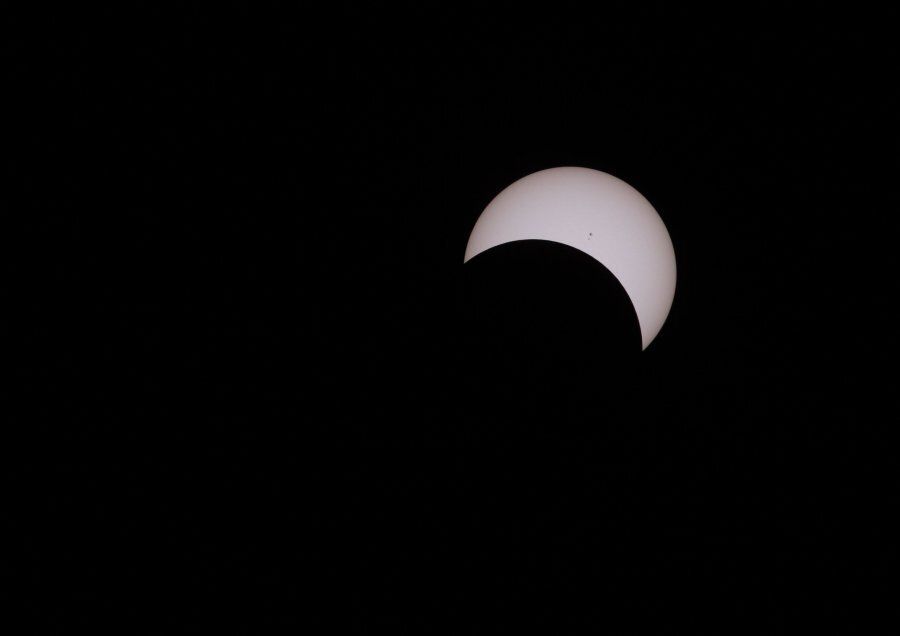 The moon covers the sun during a partial solar eclipse in Victoria on Aug. 21, 2017.