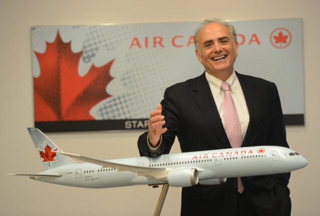 Air Canada CEO Calin Rovinescu stands next to a model of the Boeing 787 Dreamliner at the Air Canada offices in Toronto, October 17, 2013.