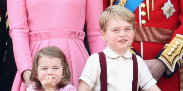 Prince George and Princess Charlotte look out from the balcony of Buckingham Palace during the Trooping the Colour parade in June 2017 in London, England. (Photo by Chris Jackson/Getty Images)