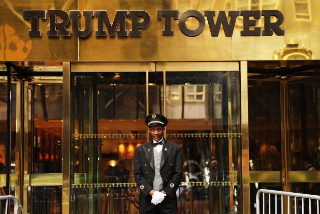 A doorman stands in front of Trump Tower along Fifth Avenue on Aug. 14, 2017 in New York City.