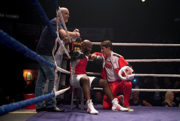 Prime Minister Justin Trudeau coaches in the corner with boxer Ali Nestor during a charity event in Montreal on Aug. 23, 2017.