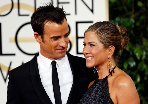 Justin Theroux and Jennifer Aniston arrive at the 72nd Golden Globe Awards in Beverly Hills, California, January 11, 2015. (REUTERS/Mario Anzuoni)